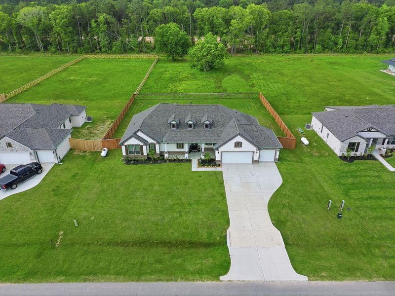 Front exterior of a new home in , Cleveland, TX, highlighting curb appeal (Image 24).
