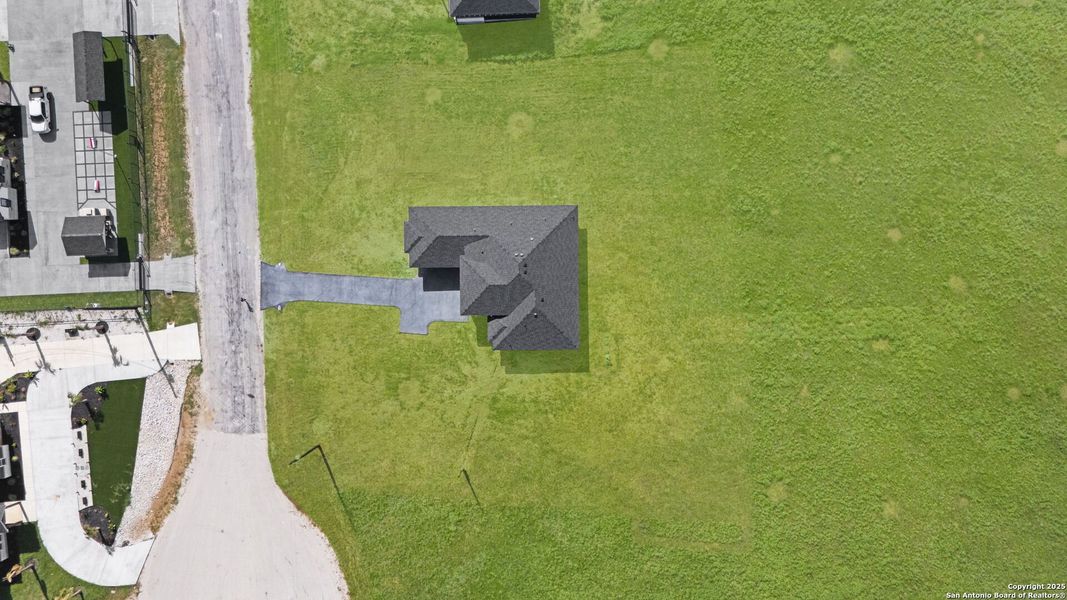 Front exterior of a new home in , Floresville, TX, highlighting curb appeal (Image 31). Front exterior of a new home in , Floresville, TX, highlighting curb appeal (Image 31).