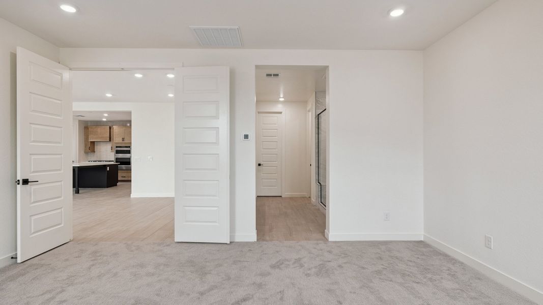 Spacious, unfurnished interior of a new home in The Ridge at Stone Butte, Phoenix (Image 32).