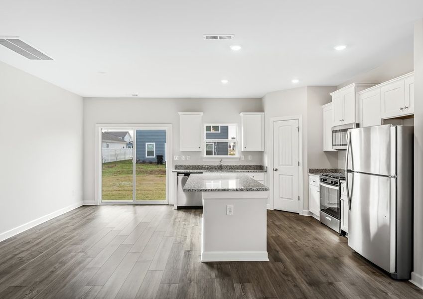 There is a sliding glass door to make access to the backyard simple