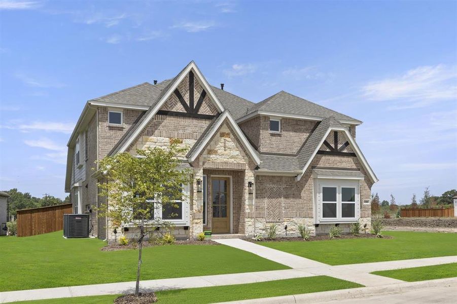 Front exterior of a new home in Trails at Cottonwood Creek, Rockwall, TX, highlighting curb appeal (Image 2).