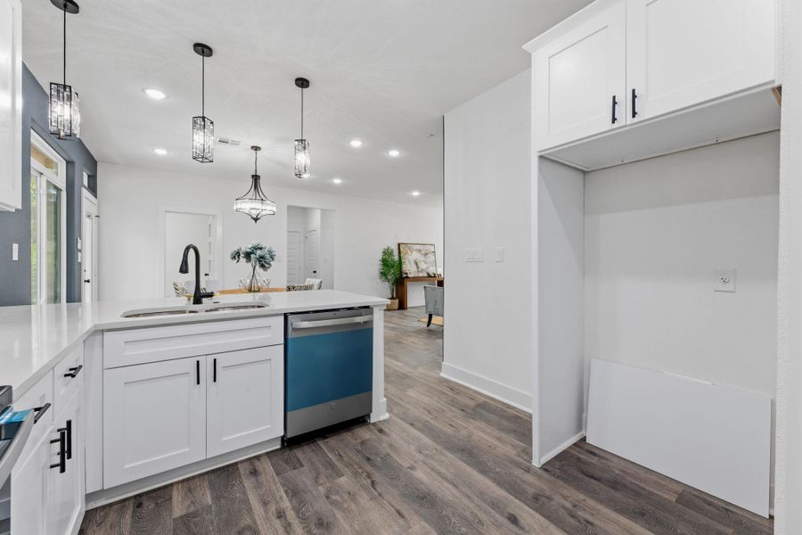 A well-appointed kitchen island with sleek counters and a modern sink.