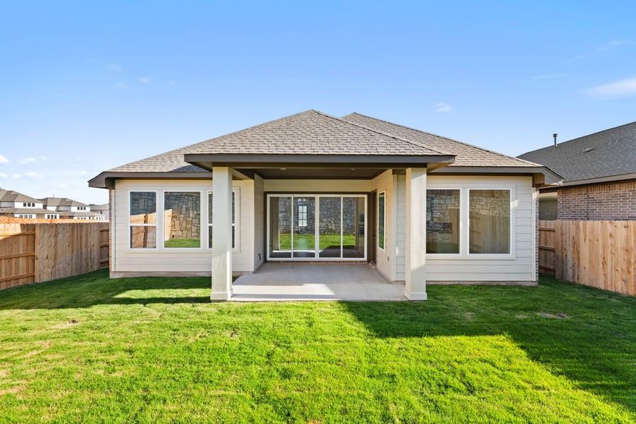 Exterior details and patio area of a home in Park Collection at Lariat, Liberty Hill (Image 26).