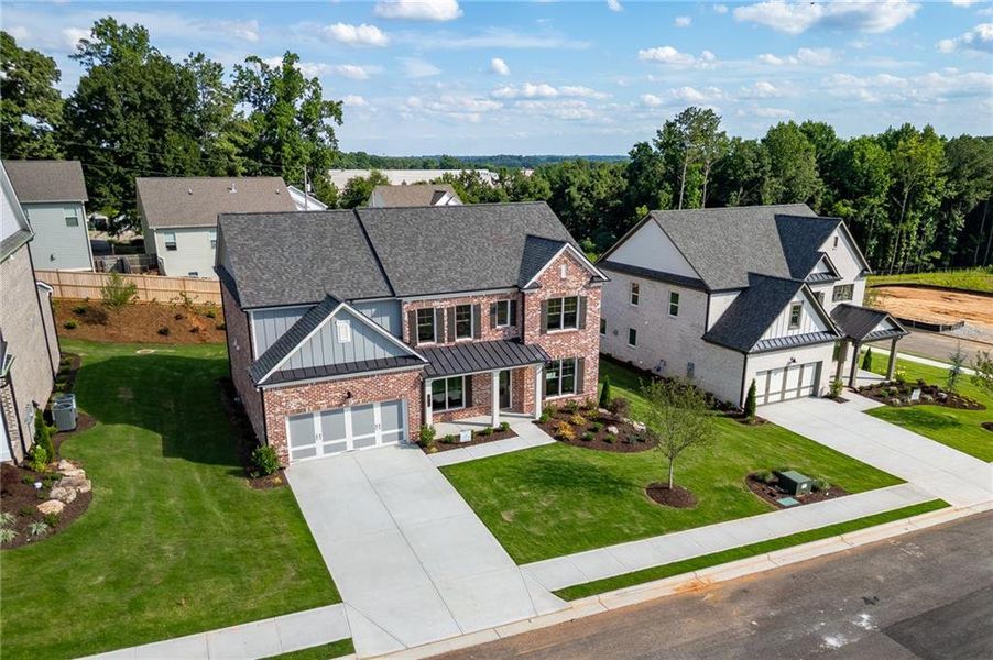 Front exterior of a new home in , Buford, GA, highlighting curb appeal (Image 26).