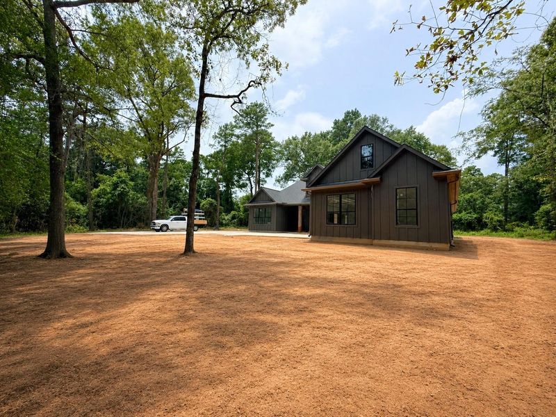 Front exterior of a new home in , Plantersville, TX, highlighting curb appeal (Image 29).