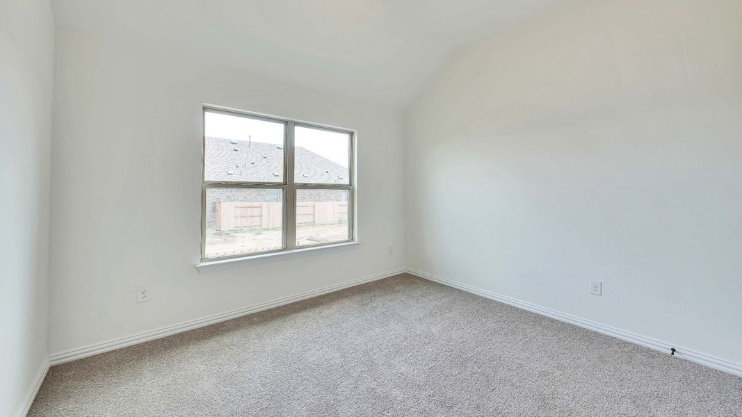 Representative furnished interior of a home built from the Palm by Brightland Homes in Sunterra, Katy (Image 11).