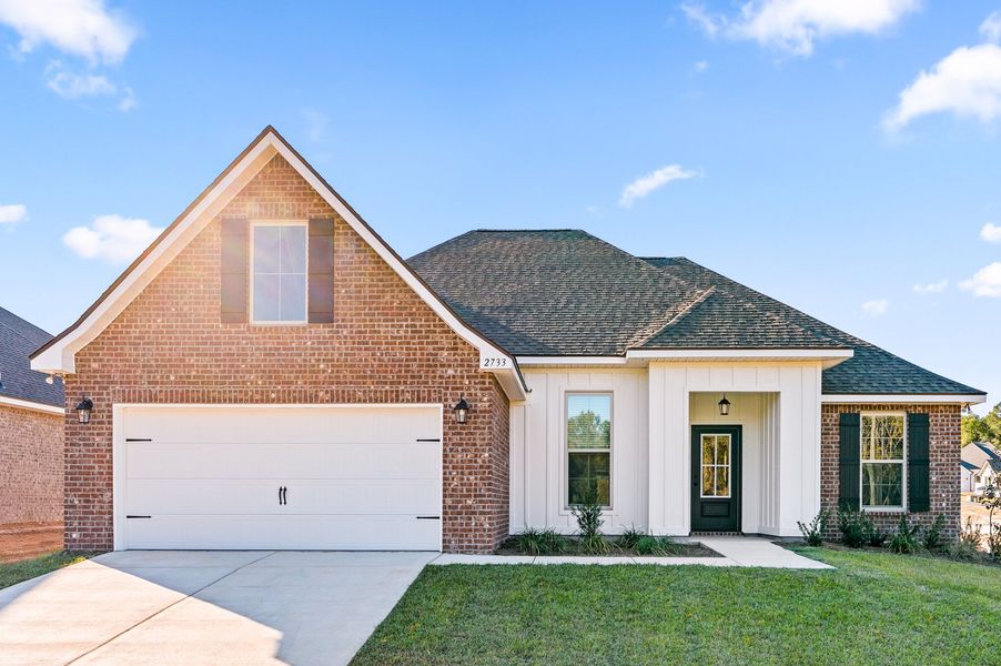 Front exterior of a new home in Young Oaks, Crestview, FL, highlighting curb appeal (Image 1).