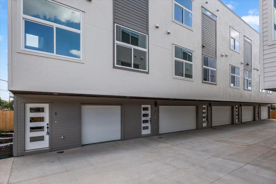 Clean lines and ample parking define this modern multi-unit facade.