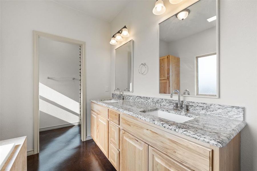 Bathroom featuring dual bowl vanity