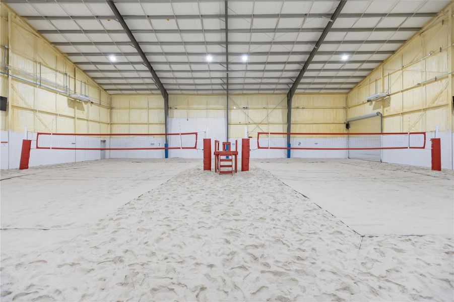 View of community featuring metal wall and a high ceiling