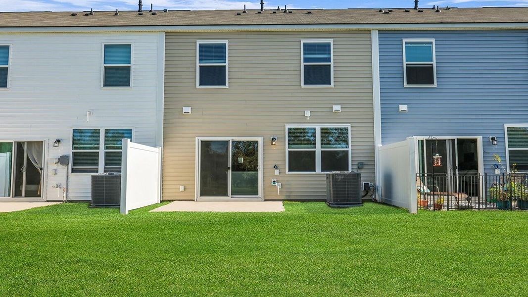 Exterior details and patio area of a home in Carolina Groves Townhomes, Moncks Corner (Image 19).