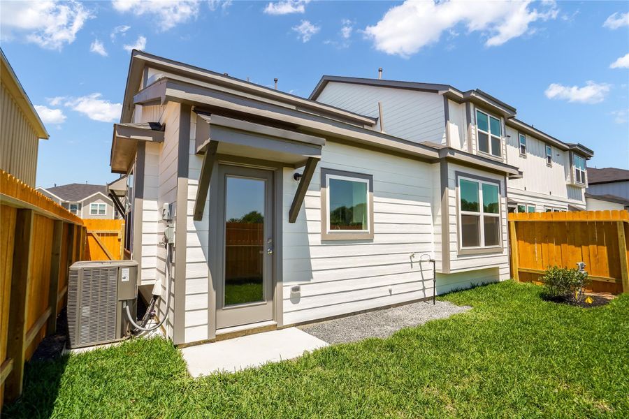 Come and see the backyard with green space.