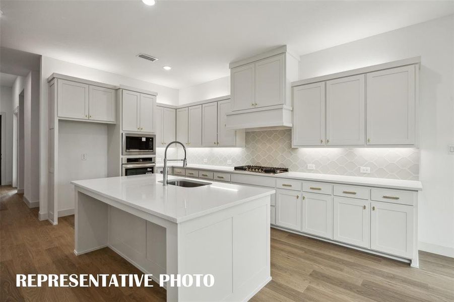With fantastic space, ample storage and contemporary appliances, this kitchen is all that you've dreamed of and more!  REPRESENTATIVE PHOTO