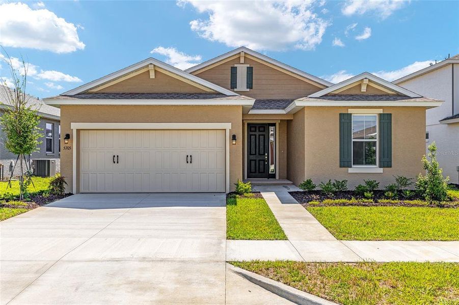 Front exterior of a new home in Calesa Township, Ocala, FL, highlighting curb appeal (Image 21).