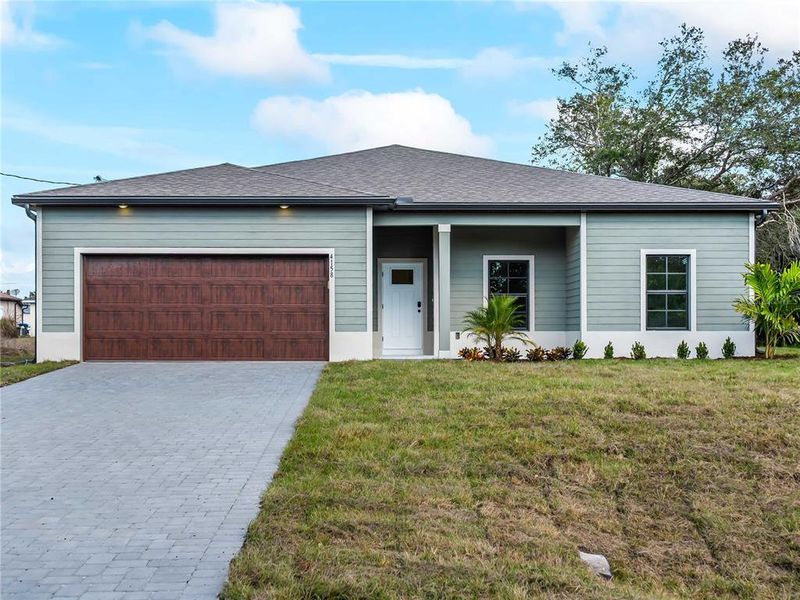 Front exterior of a new home in , North Port, FL, highlighting curb appeal (Image 31).
