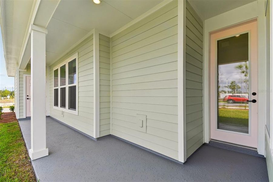 Exterior details and patio area of a home in Weslyn Park in Sunbridge 34', St. Cloud (Image 4).