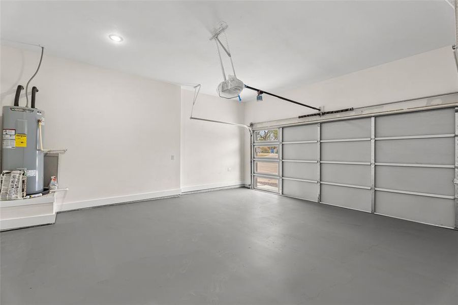 Garage with water heater and a garage door opener Garage with water heater and a garage door opener