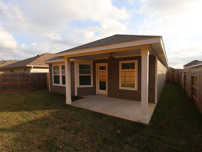 Exterior details and patio area of a home in Pinewood at Grand Texas, New Caney (Image 4).