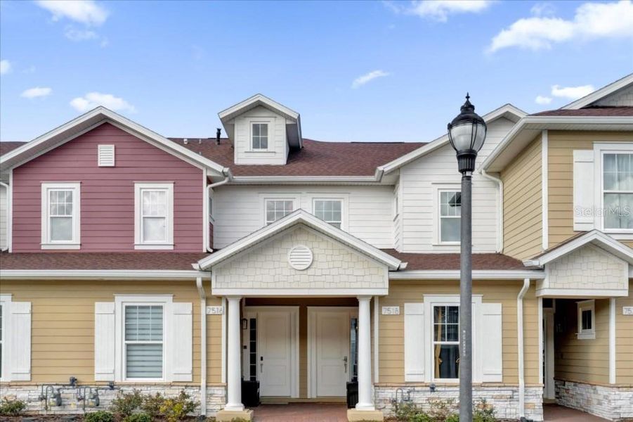 Front exterior of a new home in , Kissimmee, FL, highlighting curb appeal (Image 2).