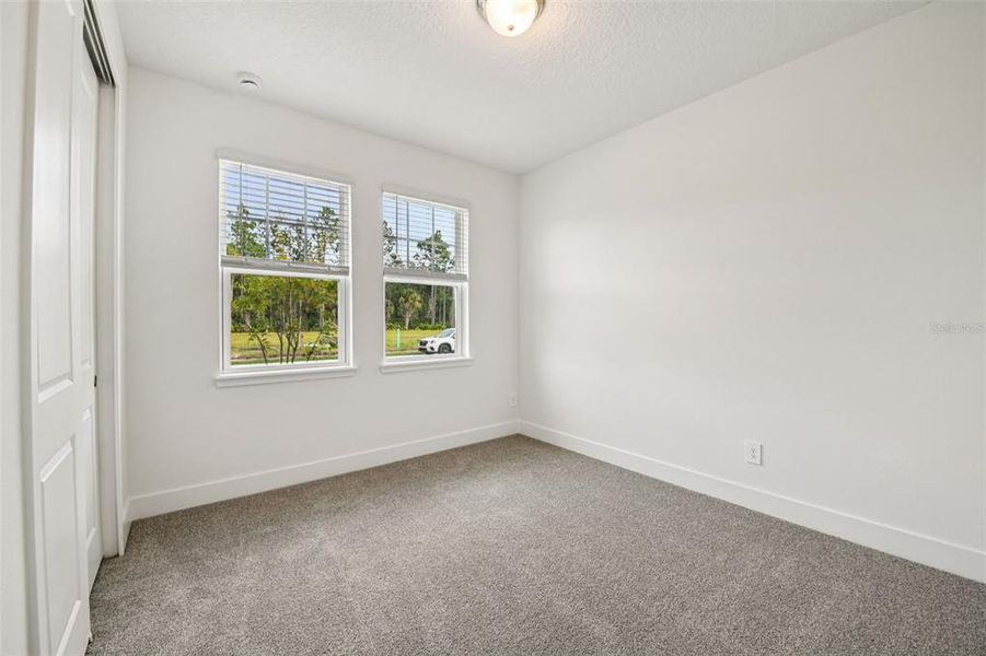 Spacious, unfurnished interior of a new home in Legends Preserve - Signature Series, Daytona Beach (Image 21).