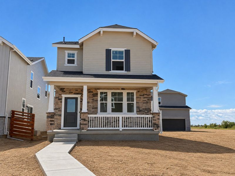 Front exterior of a new home in The Aurora Highlands, Aurora, CO, highlighting curb appeal (Image 1). Front exterior of a new home in The Aurora Highlands, Aurora, CO, highlighting curb appeal (Image 1).