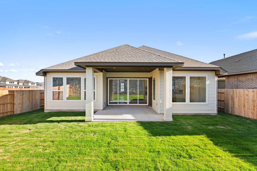 Exterior details and patio area of a home in Lariat, Liberty Hill (Image 23).