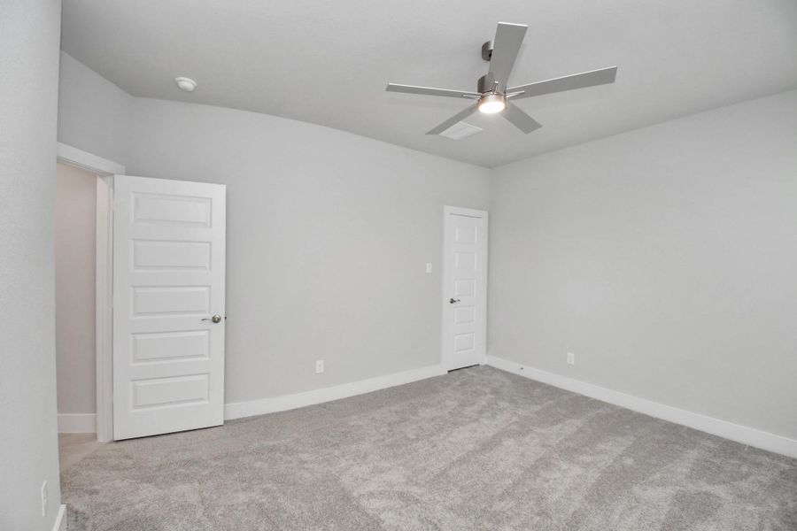 Secondary bedroom features plush carpeting, large windows that let in plenty of natural light, bright paint, and spacious closets. Secondary bedroom features plush carpeting, large windows that let in plenty of natural light, bright paint, and spacious closets.