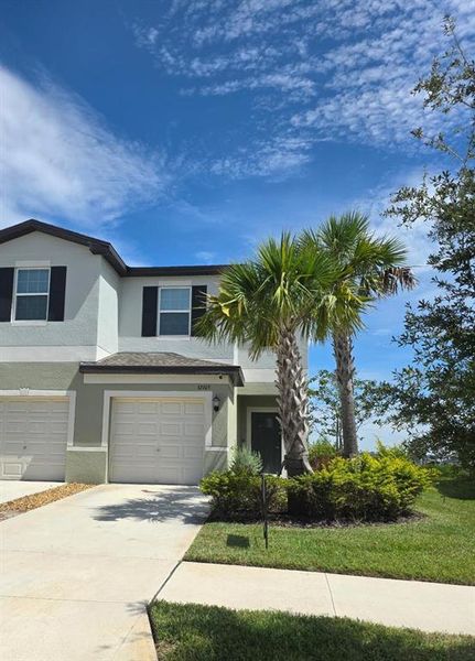 Front exterior of a new home in , San Antonio, FL, highlighting curb appeal (Image 1).