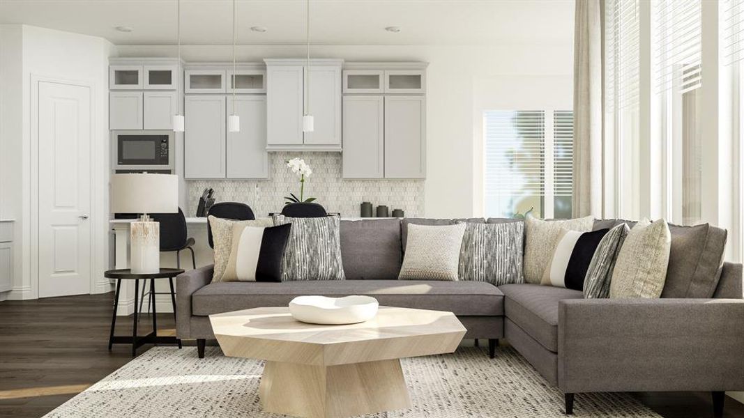 Living room with a wealth of natural light and dark hardwood / wood-style flooring