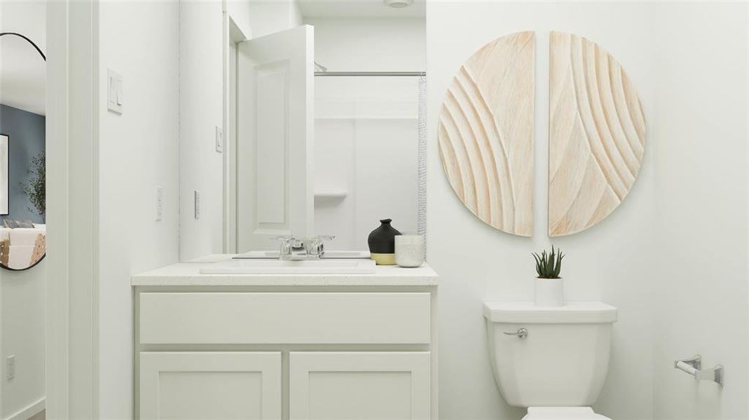 Bathroom featuring vanity, toilet, and walk in shower