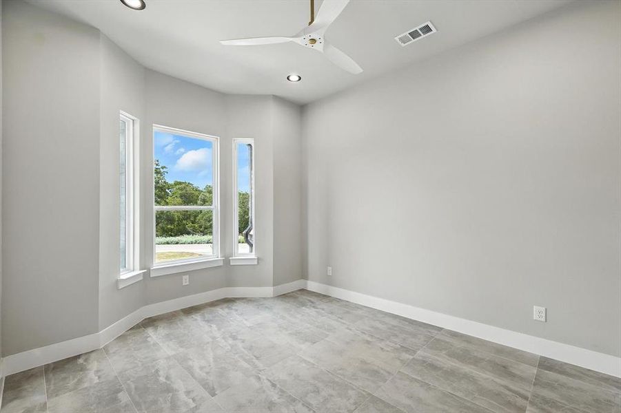 Empty room featuring recessed lighting and a ceiling fan