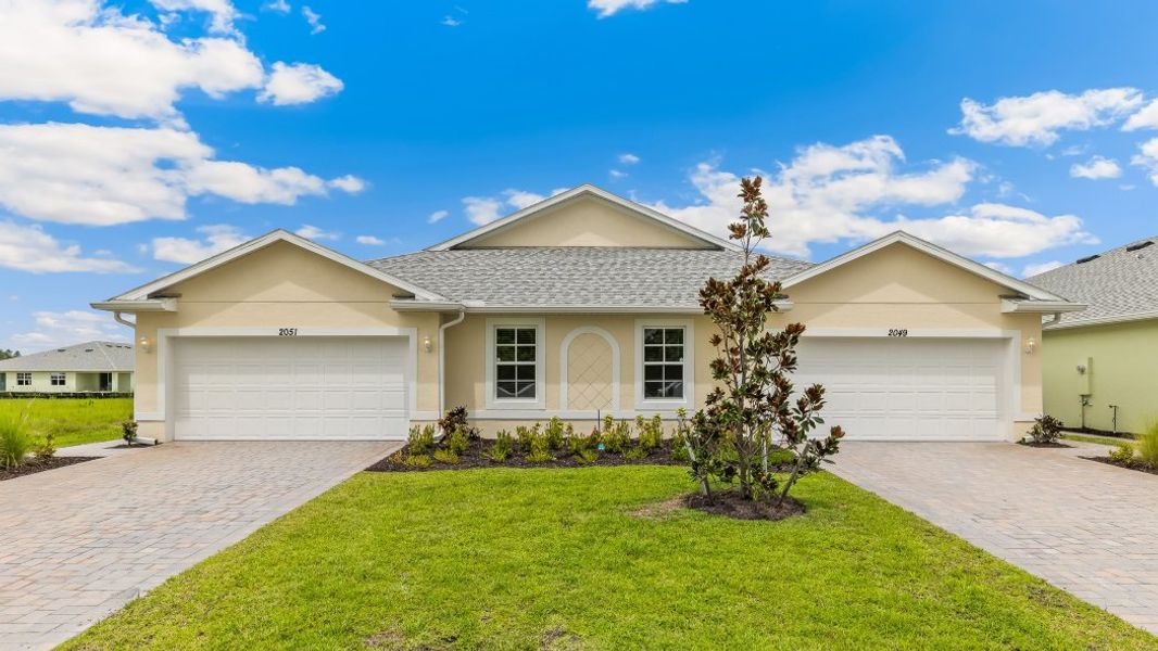 Representative exterior photo of a completed home built from the CARRINGTON by D.R. Horton in Heritage Lake Park, Punta Gorda, FL (Image 18).