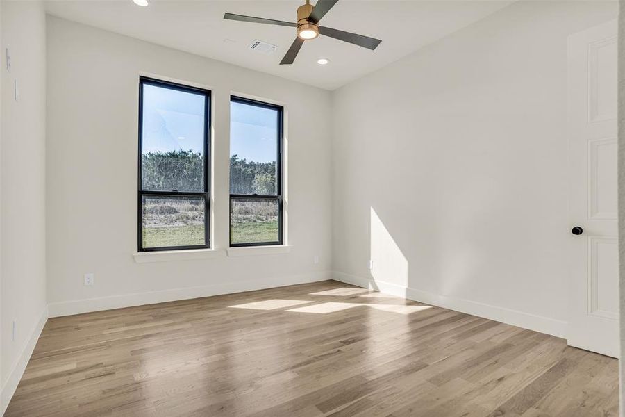 Unfurnished room with light wood-style flooring, recessed lighting, and ceiling fan Unfurnished room with light wood-style flooring, recessed lighting, and ceiling fan