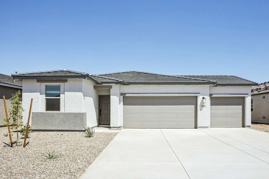 Representative exterior photo of a completed home built from the Poppy by Ashton Woods in Alba at Amarillo Creek, Maricopa, AZ (Image 15).