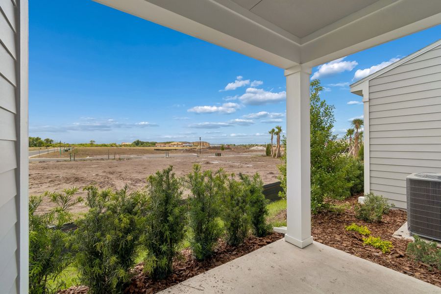 Representative exterior details of a home built from the The Cowden by David Weekley Homes in Waterset Townhomes, Apollo Beach (Image 4).
