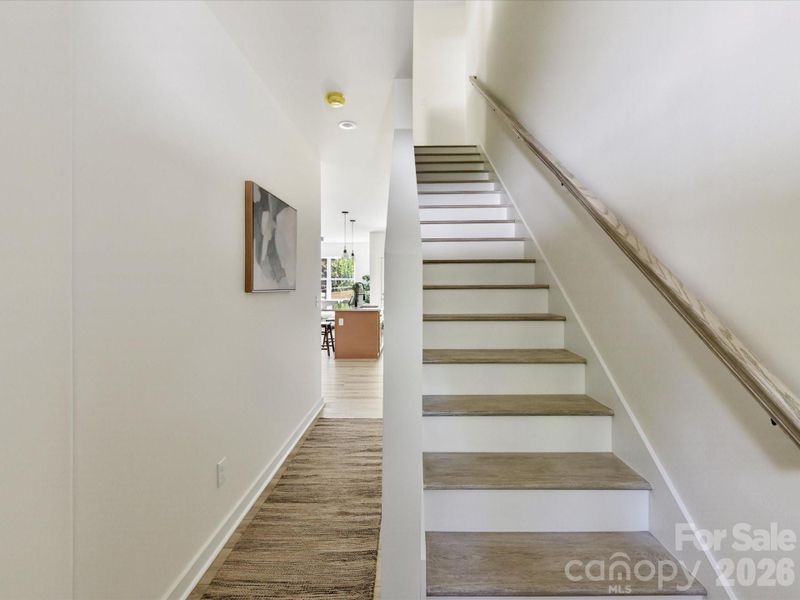 Bright and welcoming new construction townhome foyer.