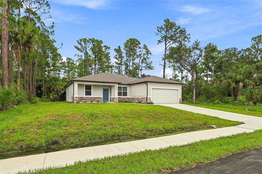 Front exterior of a new home in , North Port, FL, highlighting curb appeal (Image 20).
