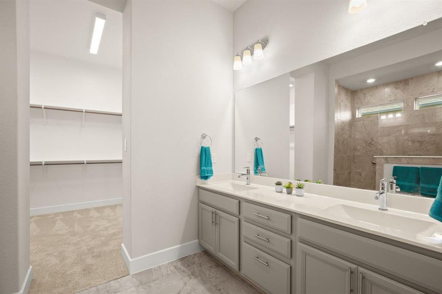 Pamper yourself in the primary bathroom with its elegant dual vanity, offering ample space for your daily routine.