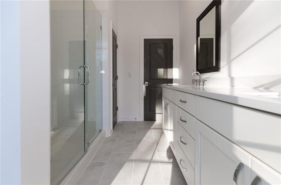 Gorgeous owners bathroom with walk in shower with tile shower pan *Home is Under Construction. Photos shown are from other TPG Communities to display how the home will live*