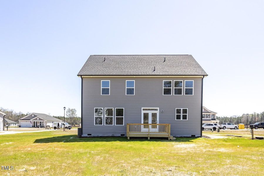 Front exterior of a new home in Wellers Knoll, Lillington, NC, highlighting curb appeal (Image 53). Front exterior of a new home in Wellers Knoll, Lillington, NC, highlighting curb appeal (Image 53).