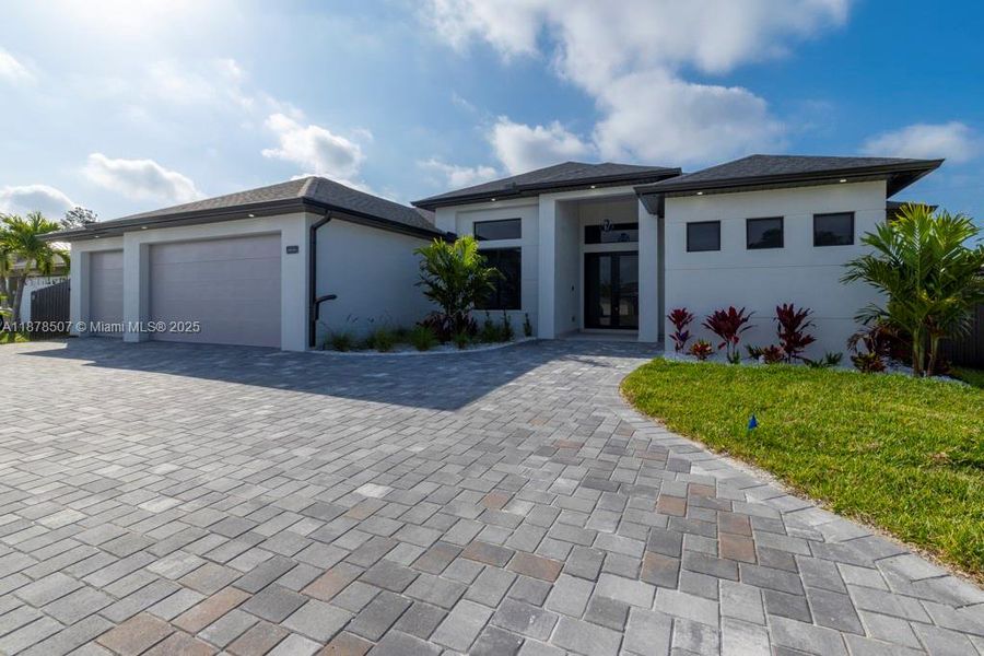 Front exterior of a new home in , Cape Coral, FL, highlighting curb appeal (Image 2).