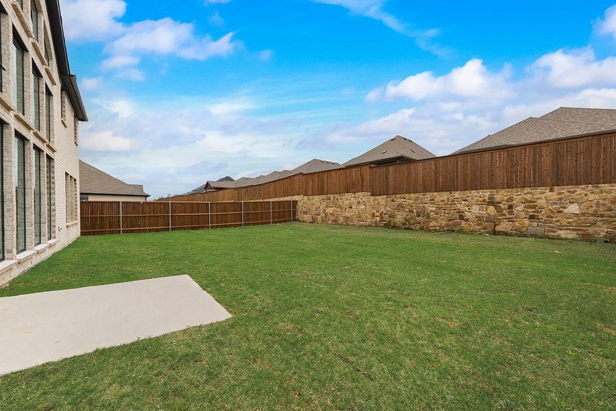 Exterior details and patio area of a home in Monterra, Fate (Image 2). Exterior details and patio area of a home in Monterra, Fate (Image 2).