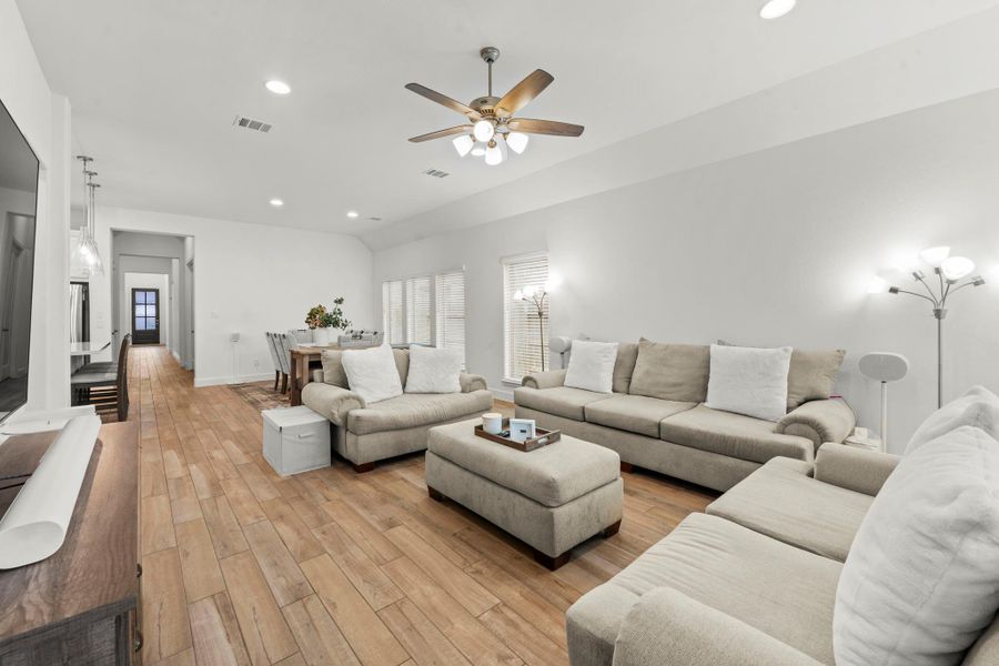 Great view of this home’s elegance looking toward the front of the home.  You will love this open concept floorplan that makes family living easy and is a dream for entertaining.