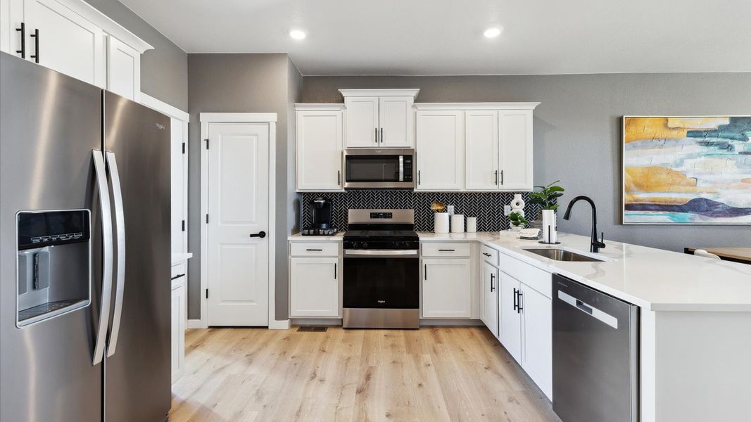 Representative furnished interior of a home built from the Larimer by D.R. Horton in Horizon Uptown, Aurora (Image 11).