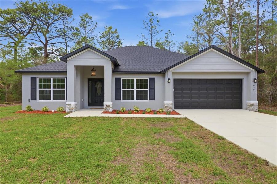 Front exterior of a new home in , Crystal River, FL, highlighting curb appeal (Image 1). Front exterior of a new home in , Crystal River, FL, highlighting curb appeal (Image 1).