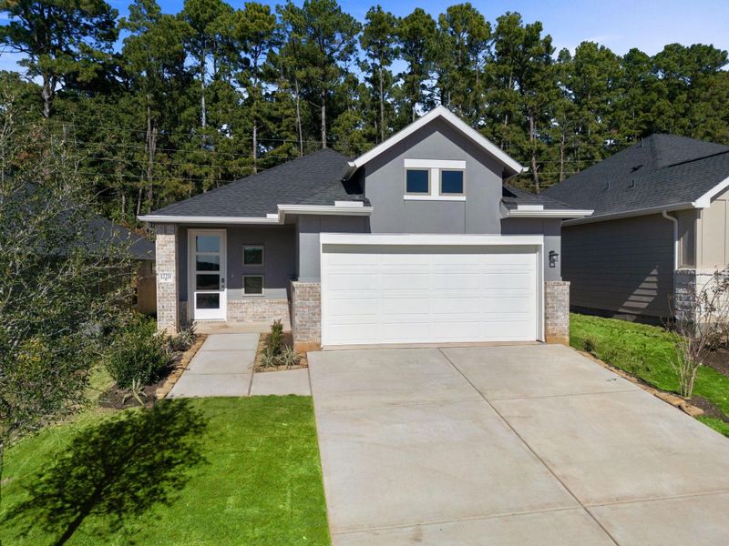Front exterior of a new home in Westridge Cove, Conroe, TX, highlighting curb appeal (Image 2).
