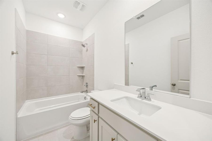 Friends and family will feel right at home in any of the beautifully finished guest baths in our Tristan plan.