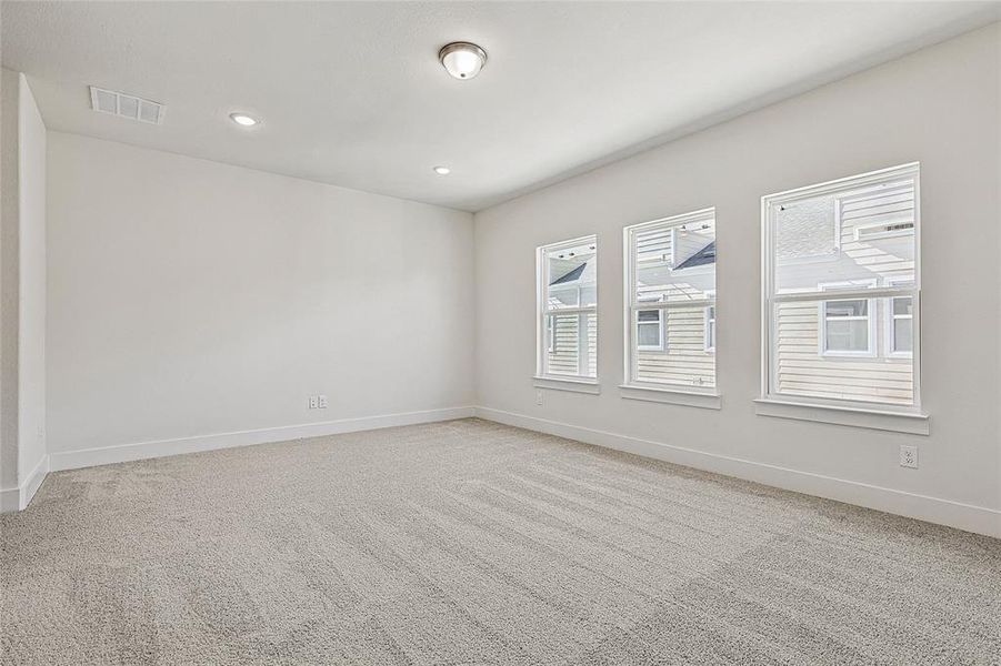 Unfurnished room featuring light carpet and recessed lighting