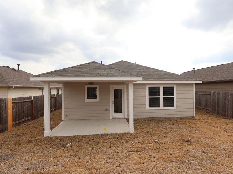 Exterior details and patio area of a home in Magnolia Ridge, Magnolia (Image 19).