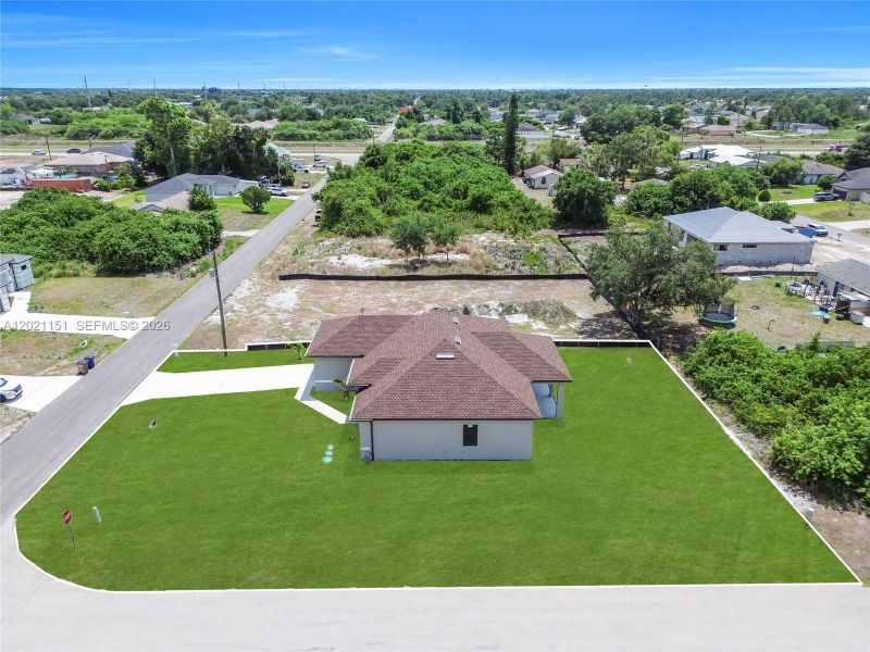 Front exterior of a new home in , Lehigh Acres, FL, highlighting curb appeal (Image 19).